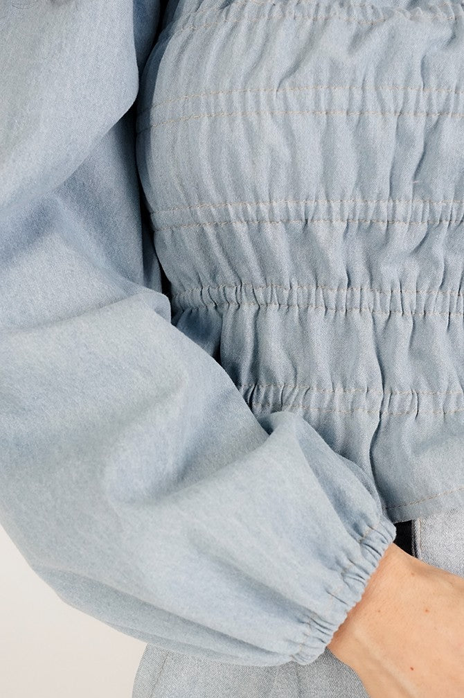Vintage Denim Blouse with frowning